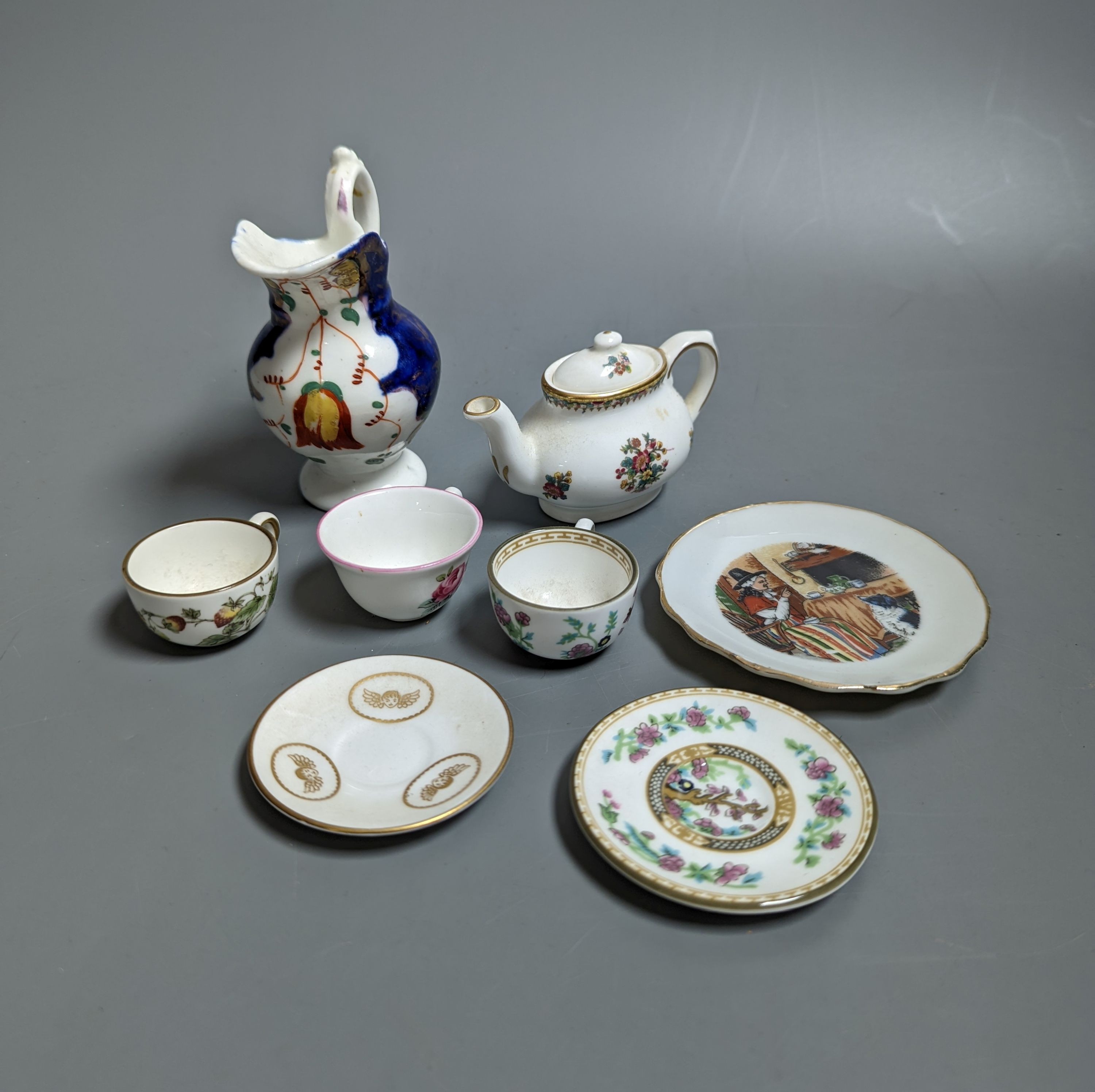 Various miniature Coalport bone china tea sets, a Staffordshire pottery moneybox and other china